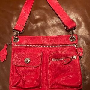Roots Village Tribe cross body bag in red color, great condition!